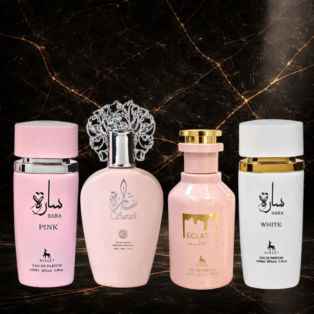 Set of four women's oriental perfumes by ZEIRA including Sara Pink, Sarah, Eclat, and Sara White bottles on display.