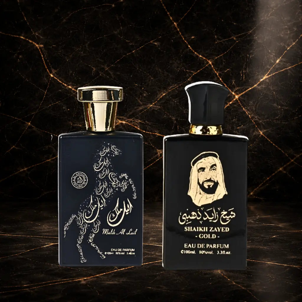 Set of two oriental men's perfumes by ZEIRA featuring Malik Al Lail and Shaikh Zayed Gold bottles on a neutral background.