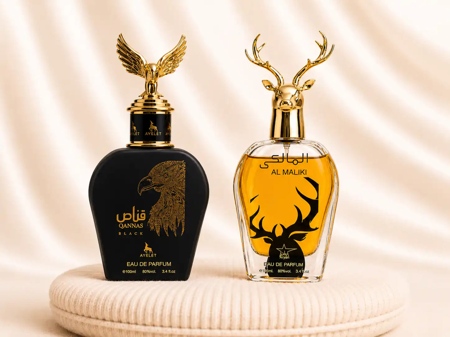 Set of two ZEIRA oriental men's perfumes, Qannas Black and Al Maliki, displayed in elegant bottles with intricate designs.