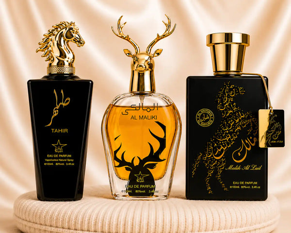 Set of three oriental men's perfumes by ZEIRA, featuring Tahir, Al Maliki, and Qannas Black in elegant bottles.