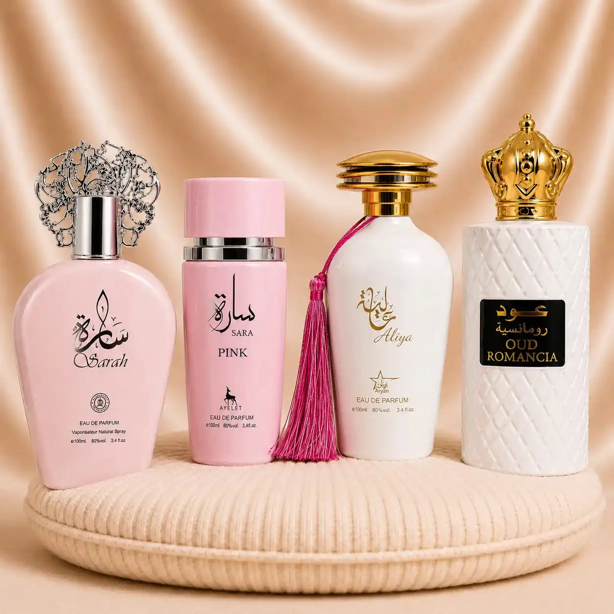 Set of four women's oriental perfumes including Sarah, Oud Romancia, Aliya, and Sara Pink by ZEIRA displayed in bottles.