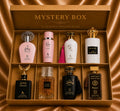 ZEIRA mystery box with 8 top Arabesti perfumes for women and men, featuring elegant bottles and a stylish presentation.
