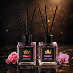 Set of 2 ZEIRA ambient perfumes with rose and orchid scents, featuring elegant bottles and floral fragrance representations.